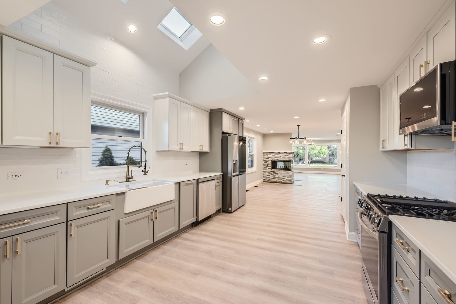 386 Blackhawk Road Riverside, IL 60546 - Photo 12 of 44 a large kitchen with stainless steel appliances lots of counter space and wooden floor
