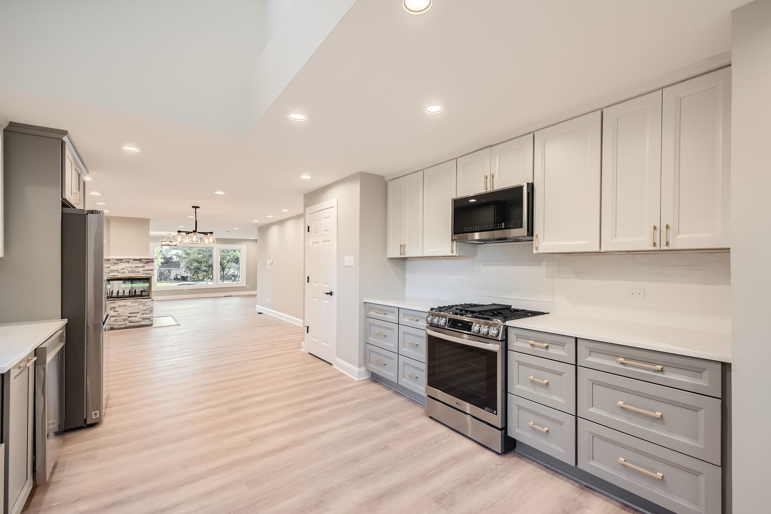386 Blackhawk Road Riverside, IL 60546 - Photo 13 of 44 a kitchen with white cabinets and stainless steel appliances