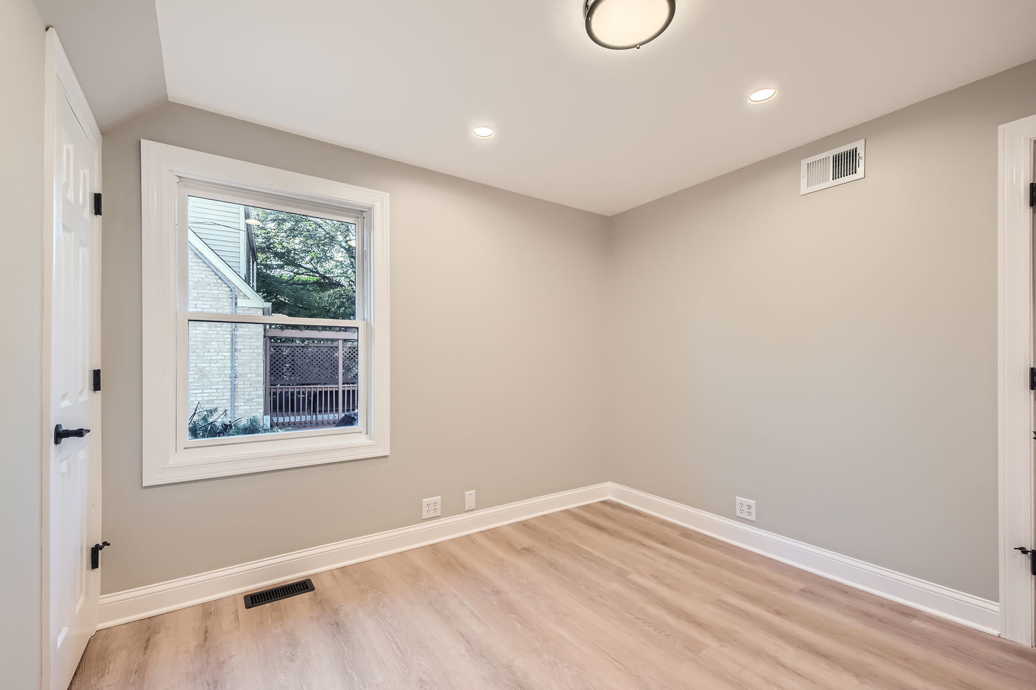 386 Blackhawk Road Riverside, IL 60546 - Photo 15 of 44 an empty room with wooden floor and windows