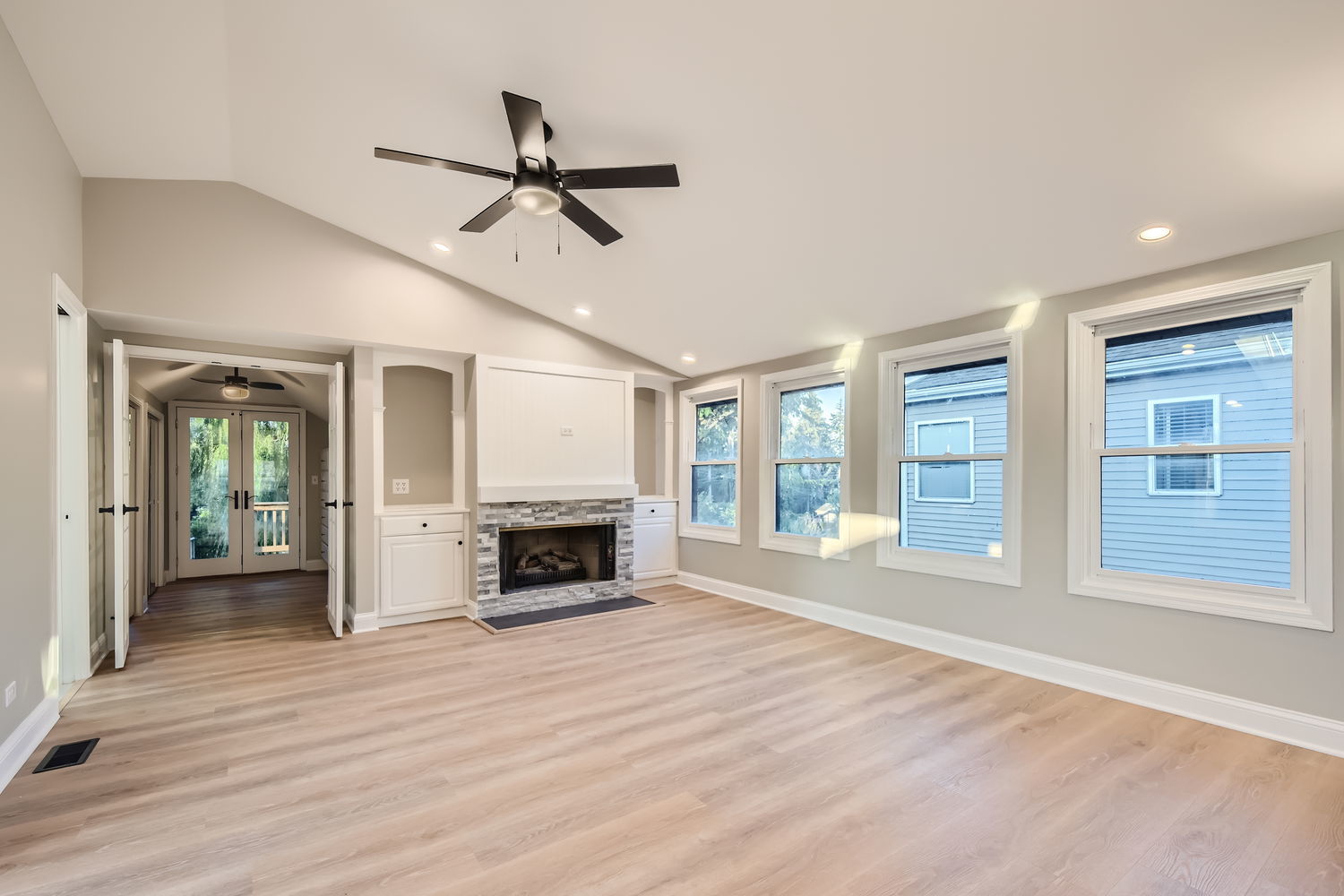 386 Blackhawk Road Riverside, IL 60546 - Photo 20 of 44 a view of empty room with wooden floor and fireplace
