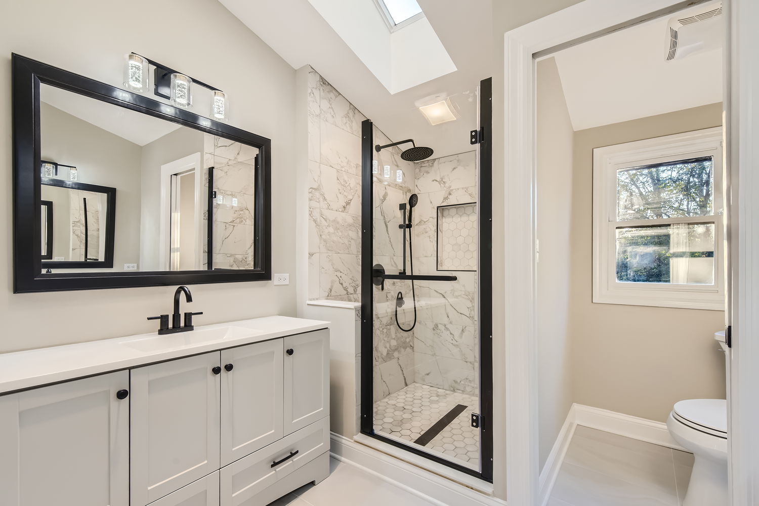 386 Blackhawk Road Riverside, IL 60546 - Photo 24 of 44 a bathroom with a toilet a sink a mirror and shower