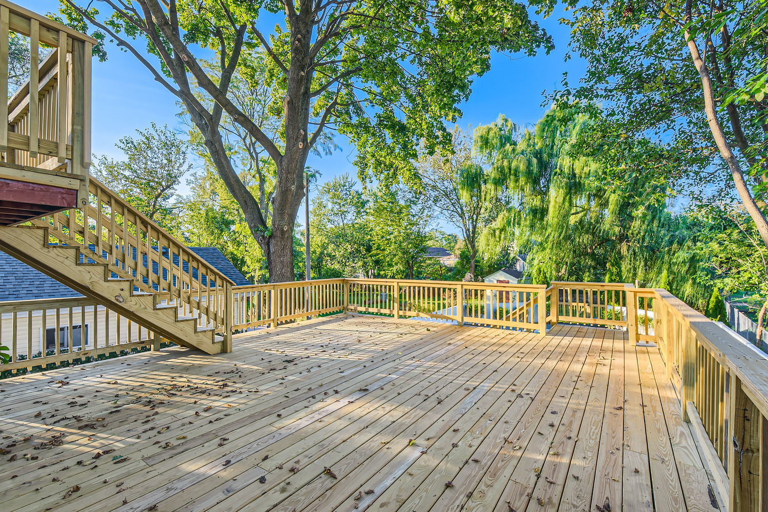 386 Blackhawk Road Riverside, IL 60546 - Photo 37 of 44 a view of balcony with wooden floor and fence