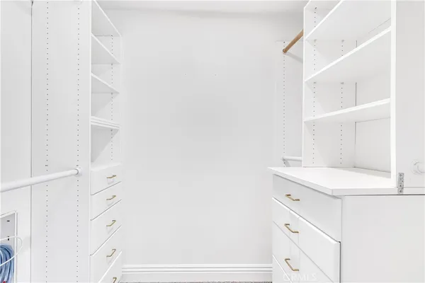 a bathroom with a sink vanity and a toilet