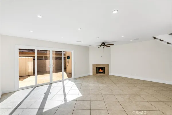 wooden floor in an empty room with a fireplace