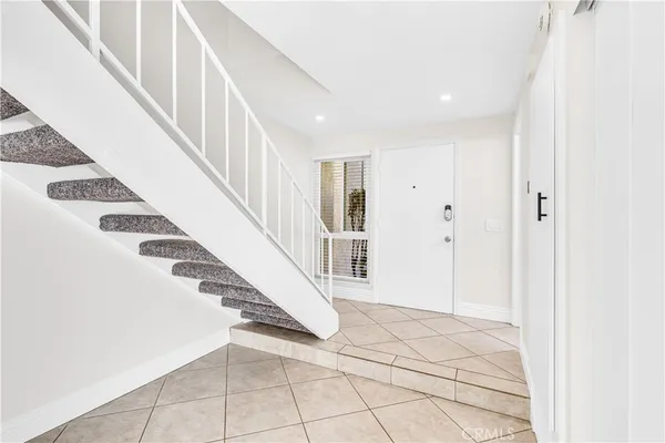 a view of kitchen with a refrigerator and a sink