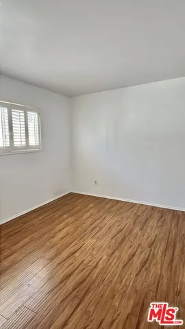 a bathroom with a shower and a toilet