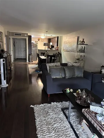 a living room with lots of furniture and appliances