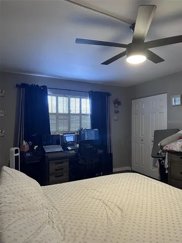 a bedroom with a bed and dresser