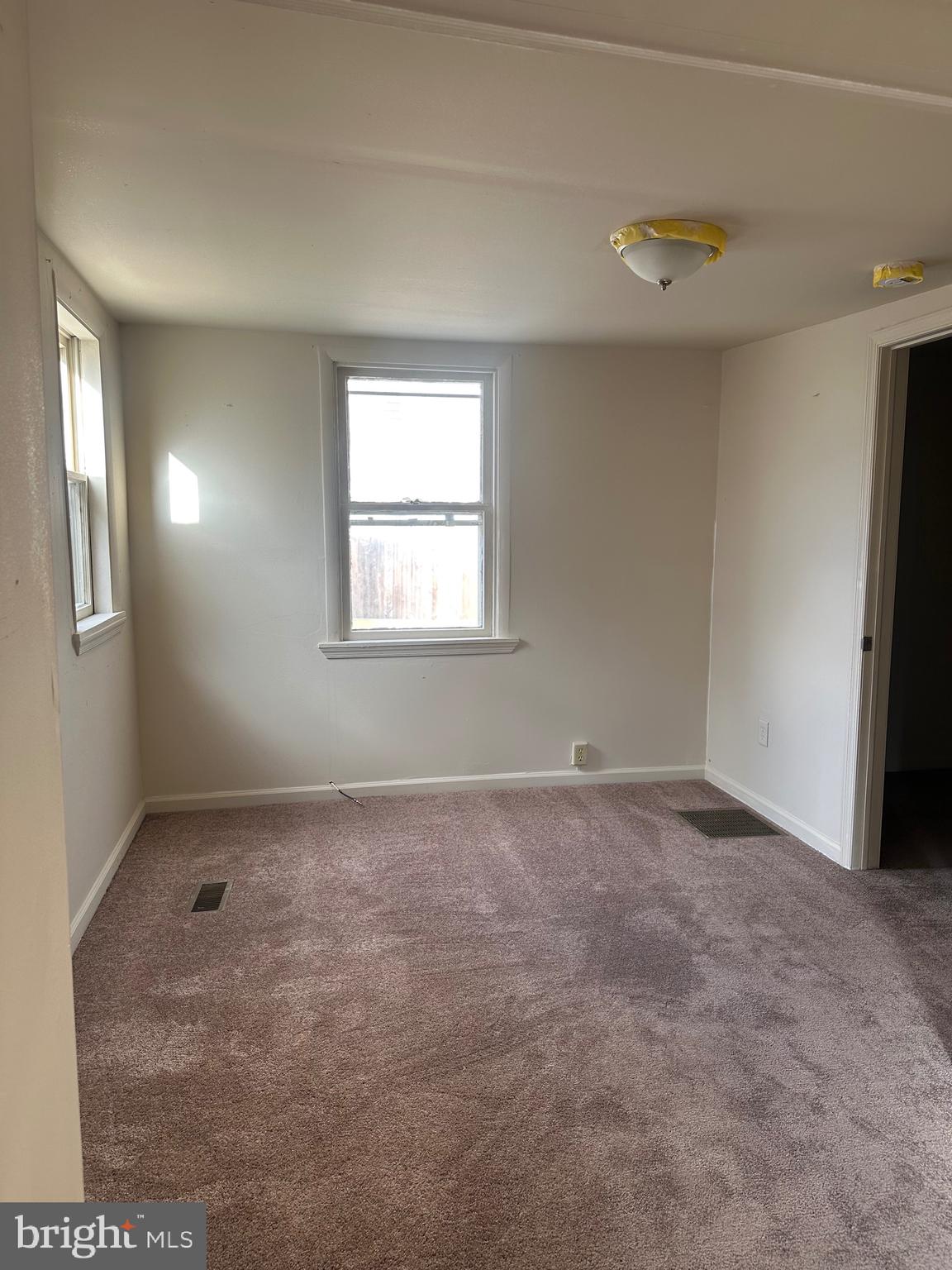615 5th Street, Unit 1 Lancaster, PA 17603 - Photo 2 of 5 an empty room with windows