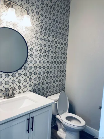 a bathroom with a toilet and a sink