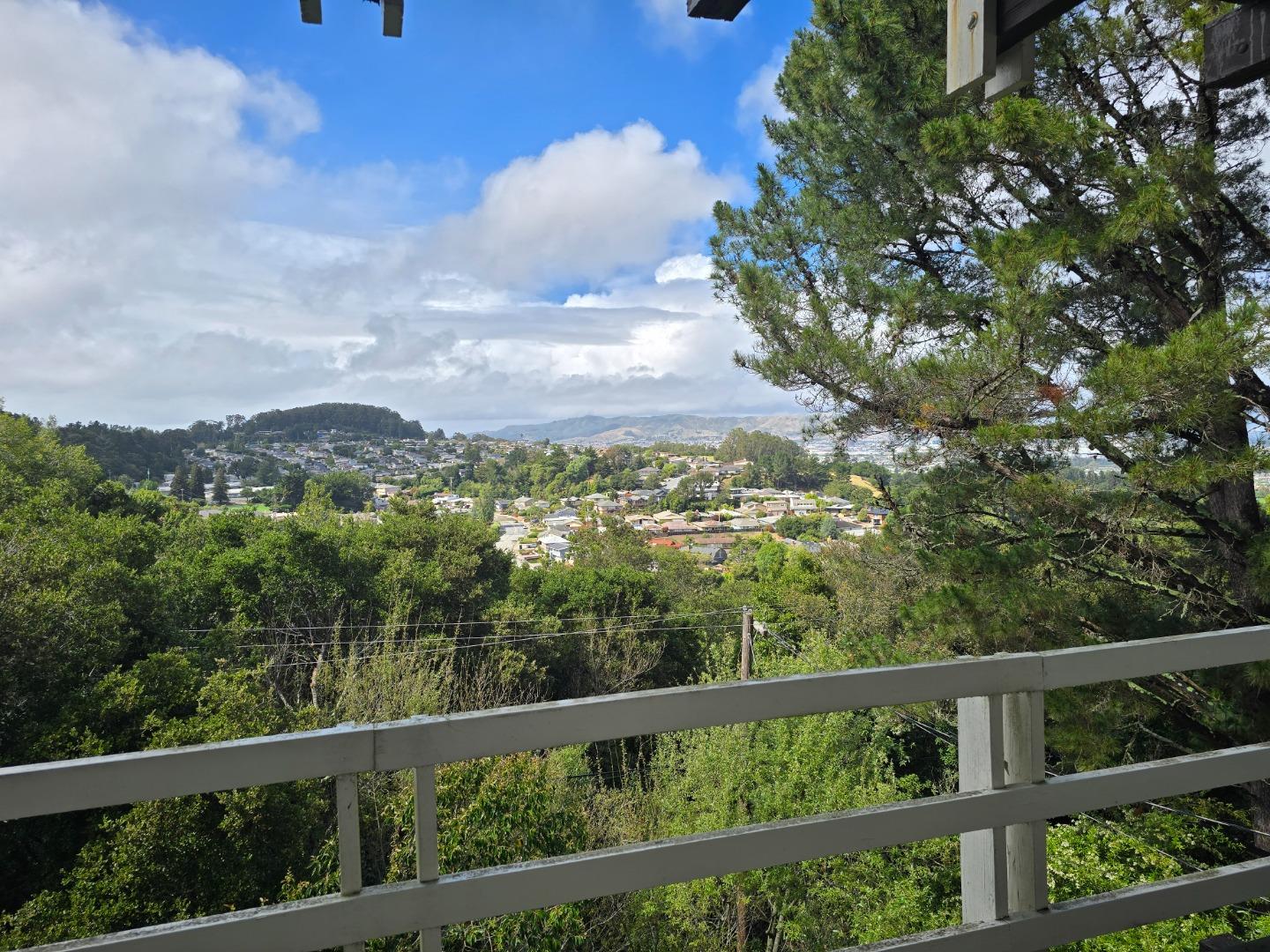 a view of a city from a balcony