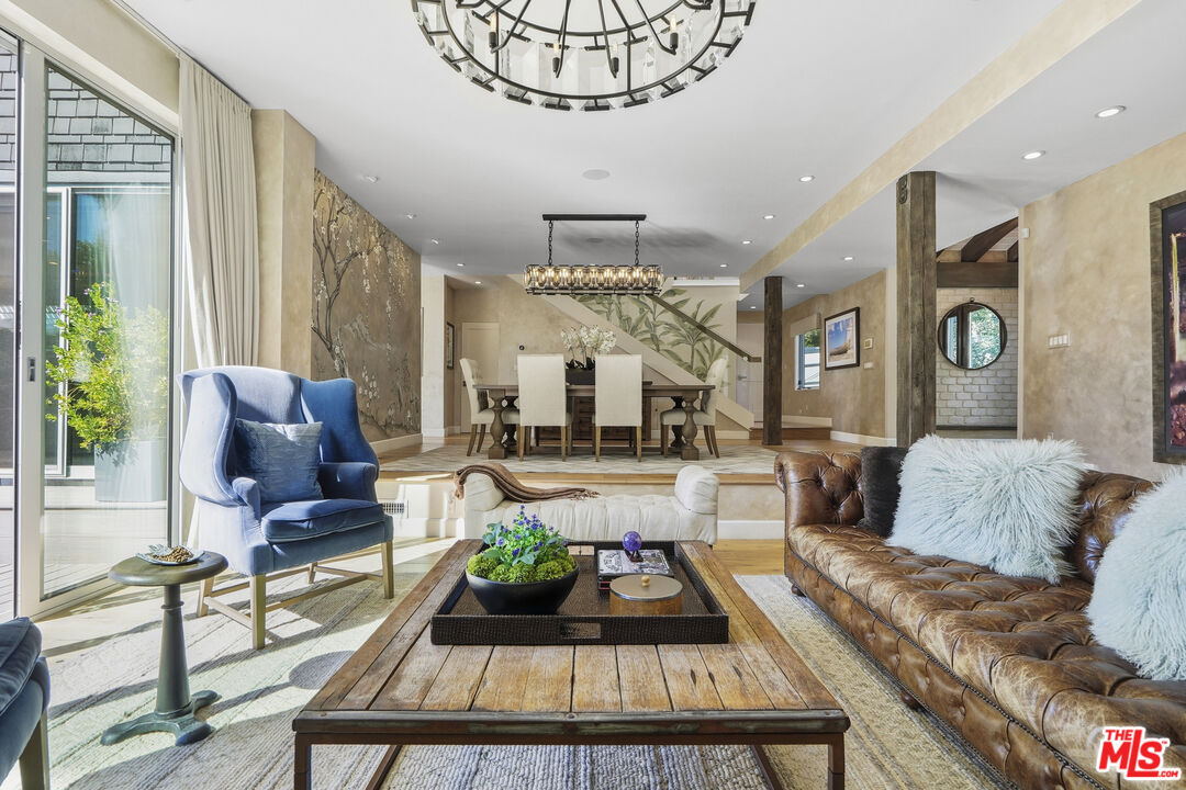 3631 Serra Road Malibu, CA 90265 - Photo 11 of 74 a living room with furniture and a chandelier