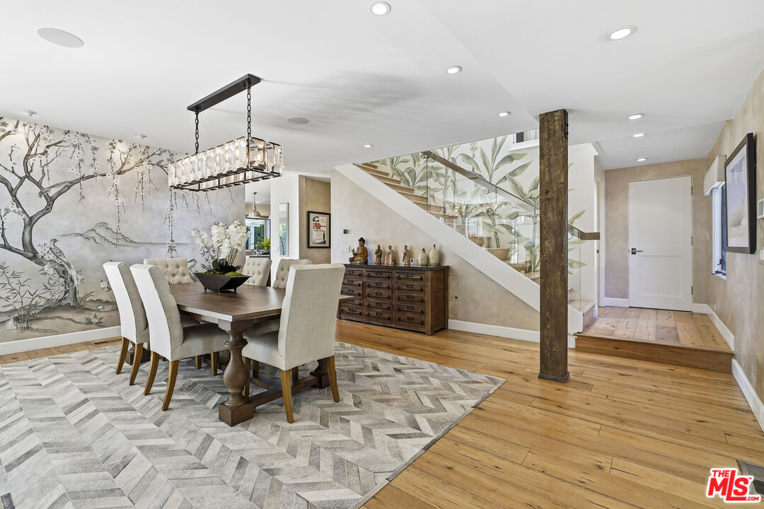 3631 Serra Road Malibu, CA 90265 - Photo 13 of 74 a dining room with furniture and wooden floor