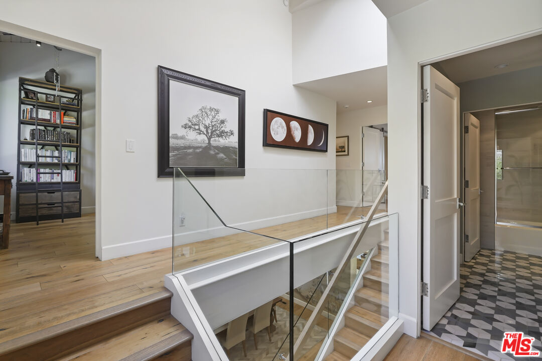 3631 Serra Road Malibu, CA 90265 - Photo 25 of 74 a view of a hallway with workspace