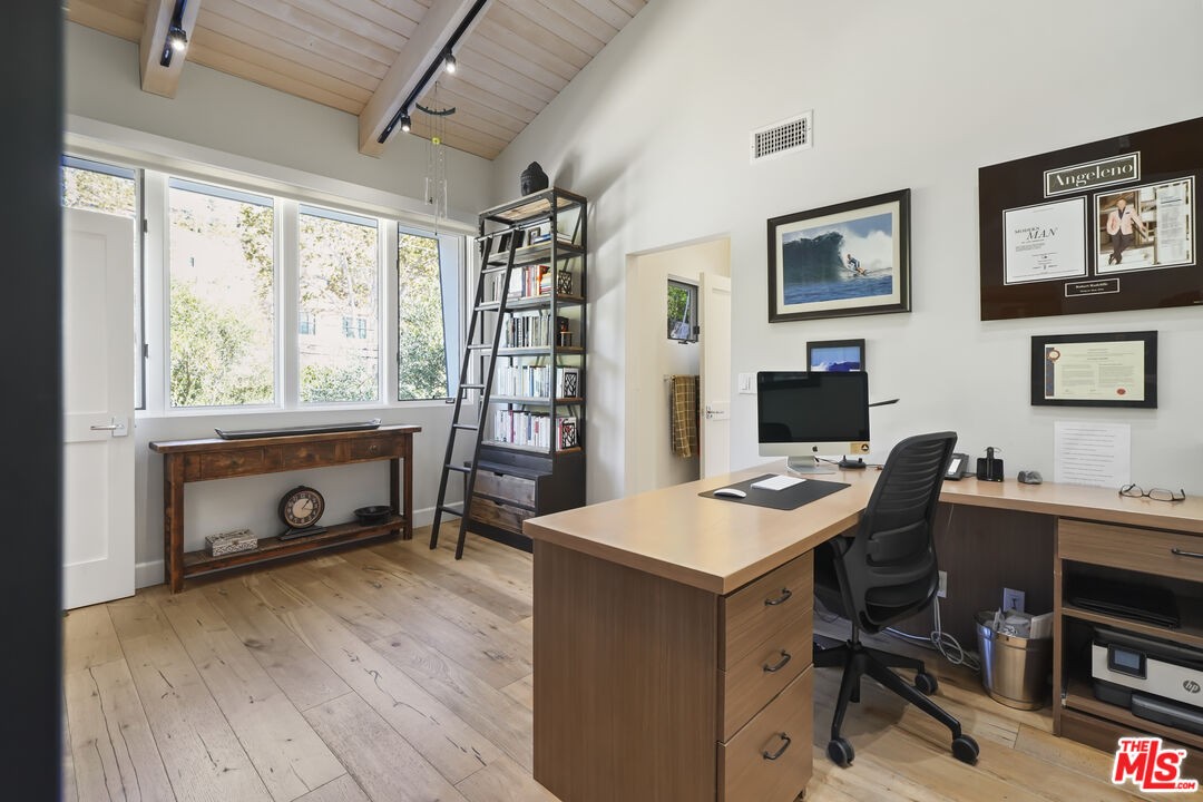 3631 Serra Road Malibu, CA 90265 - Photo 33 of 74 a workspace with furniture hardwood and a window
