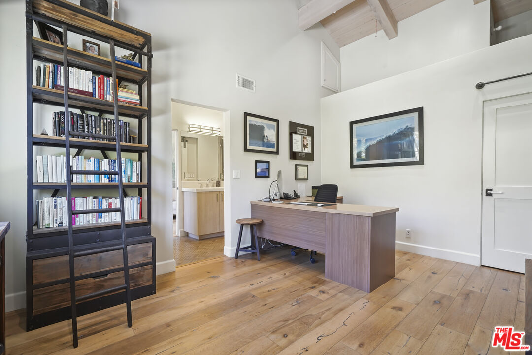 3631 Serra Road Malibu, CA 90265 - Photo 41 of 74 a living room with furniture and a wooden floor