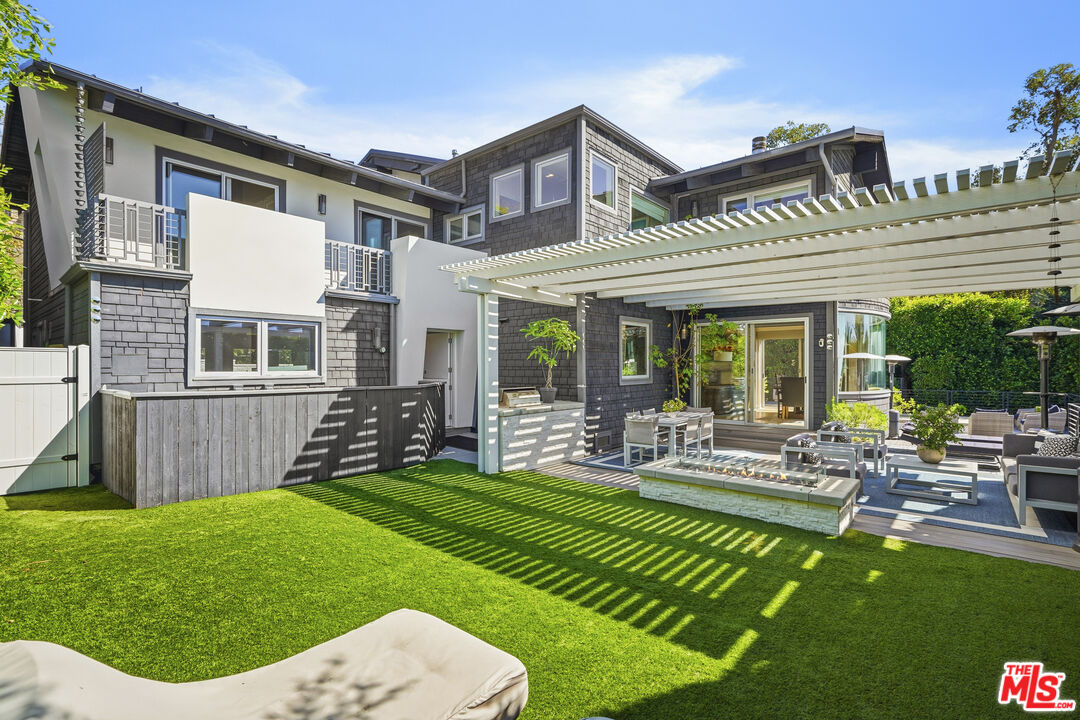 3631 Serra Road Malibu, CA 90265 - Photo 49 of 74 a view of a house with a yard porch and sitting area