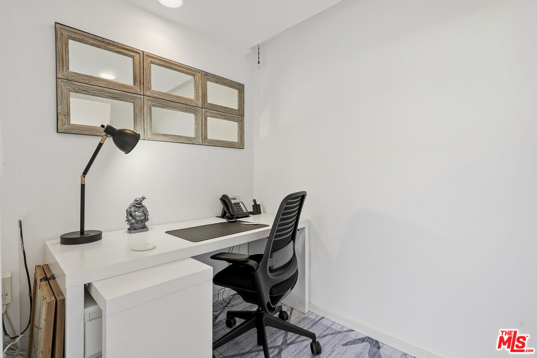 3631 Serra Road Malibu, CA 90265 - Photo 52 of 74 a dining room with a table and chairs