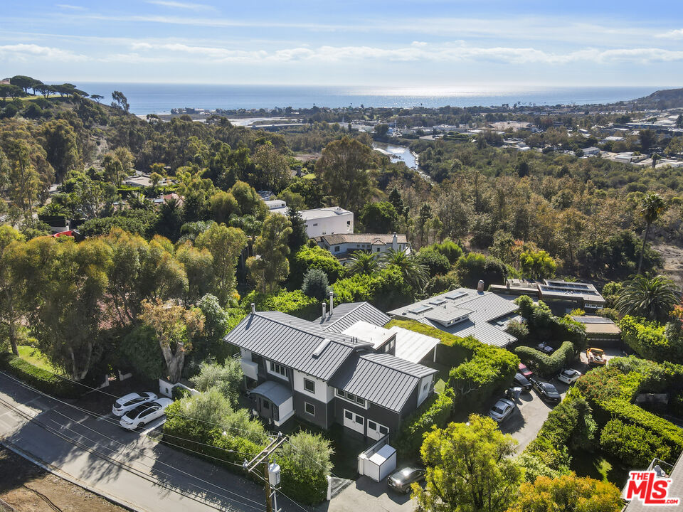 3631 Serra Road Malibu, CA 90265 - Photo 6 of 74 an aerial view of a house with a garden