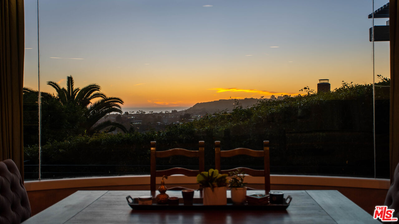 3631 Serra Road Malibu, CA 90265 - Photo 65 of 74 a view of a terrace with chairs