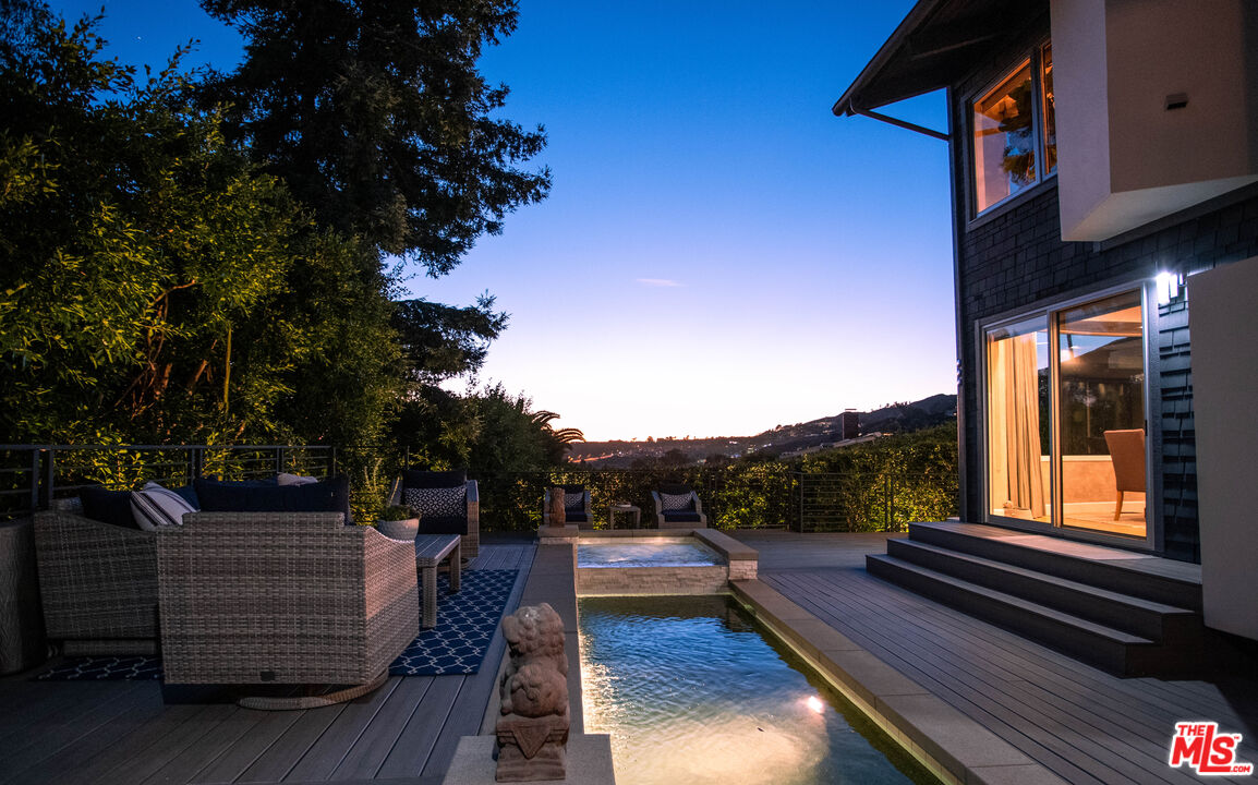 3631 Serra Road Malibu, CA 90265 - Photo 72 of 74 a view of deck with wooden floor and outdoor seating