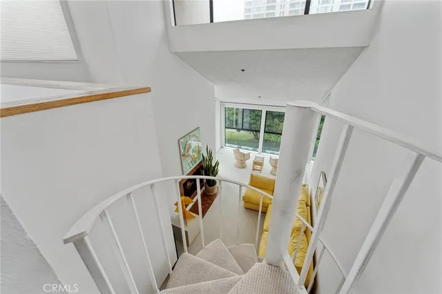 a view of living room with furniture and white walls