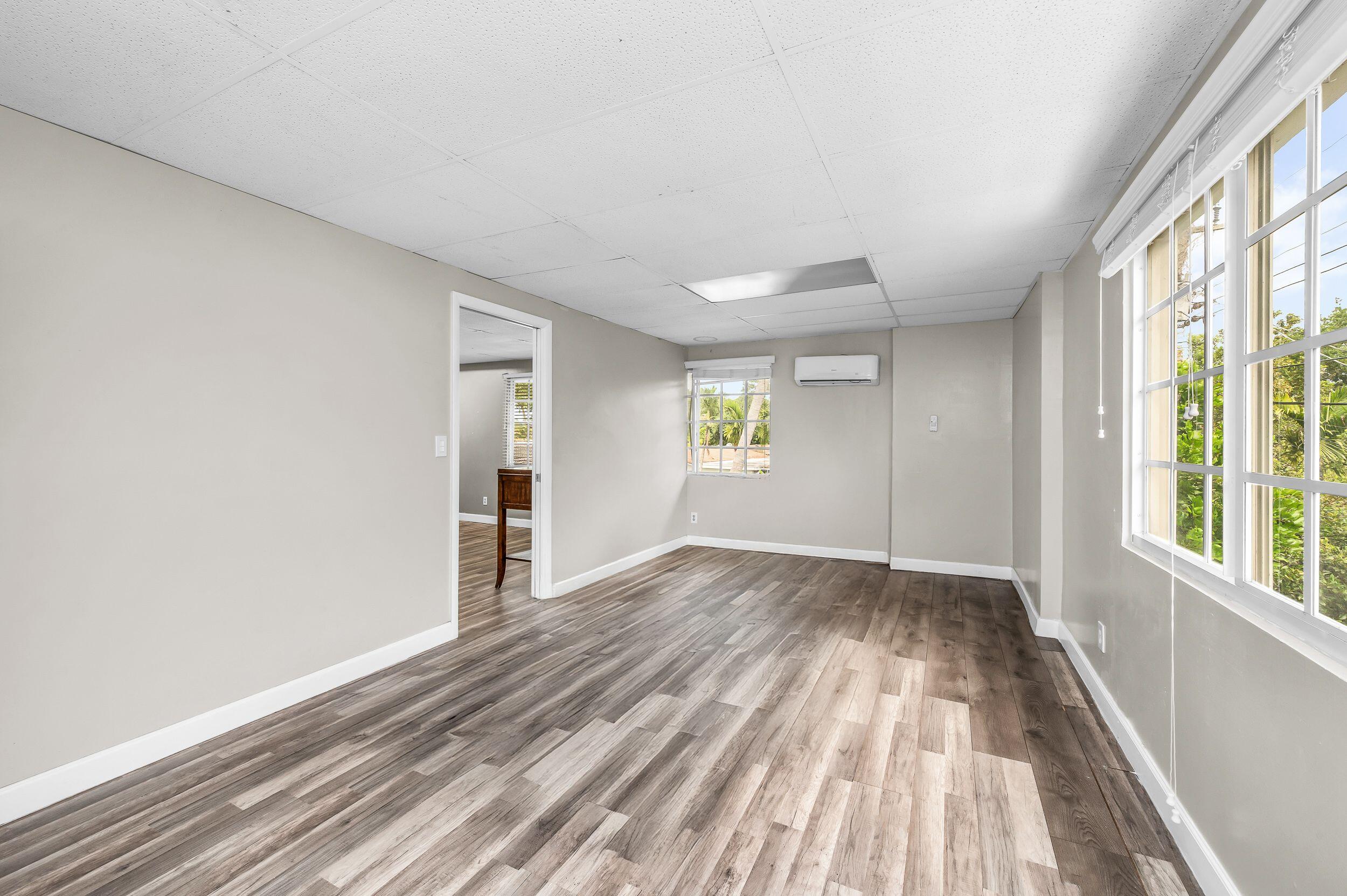 4734 Jefferson Street Hollywood, FL 33021 - Photo 56 of 68 wooden floor in an empty room with a window