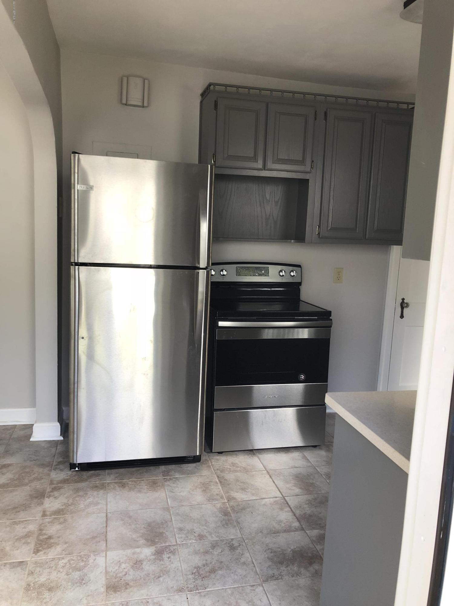 904 Old Hickory Road Jacksonville, FL 32207 - Photo 16 of 24 a kitchen with a refrigerator and a stove