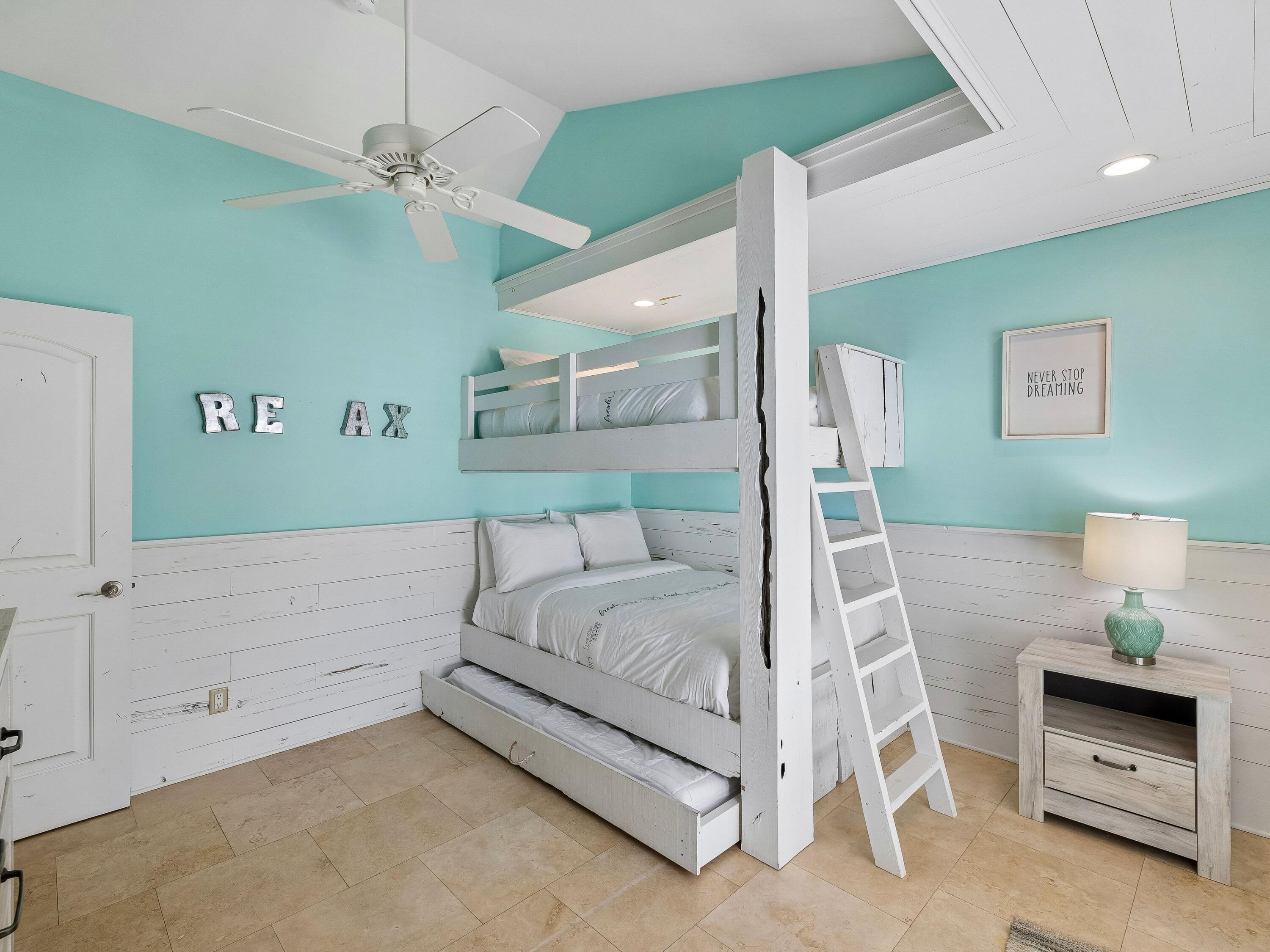 36 Green Street Inlet Beach, FL 32461 - Photo 21 of 27 a bedroom with a bed and a chandelier fan