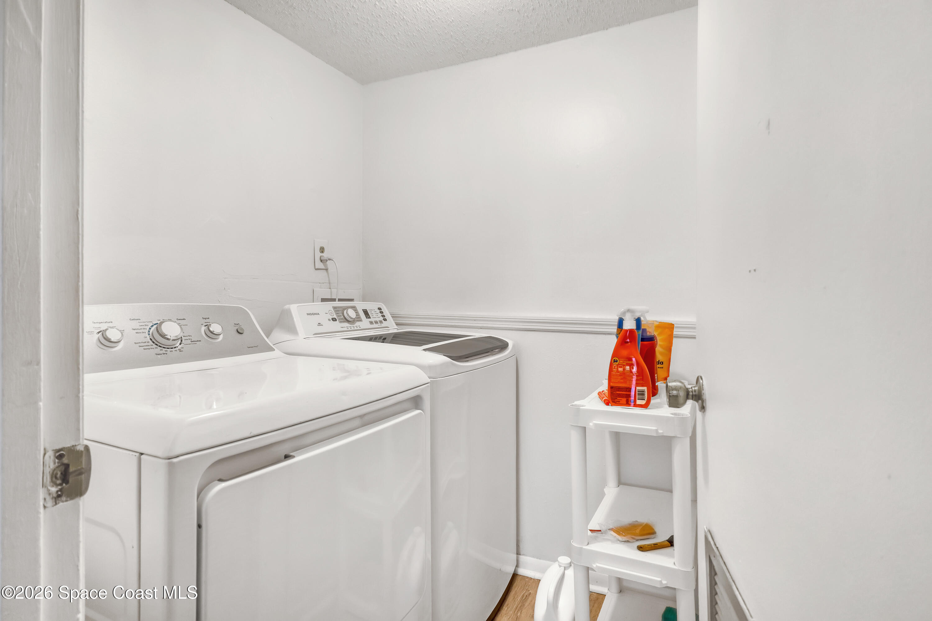 588 North Wickham Road, Unit 51 Melbourne, FL 32935 - Photo 12 of 27 a utility room with dryer and washer