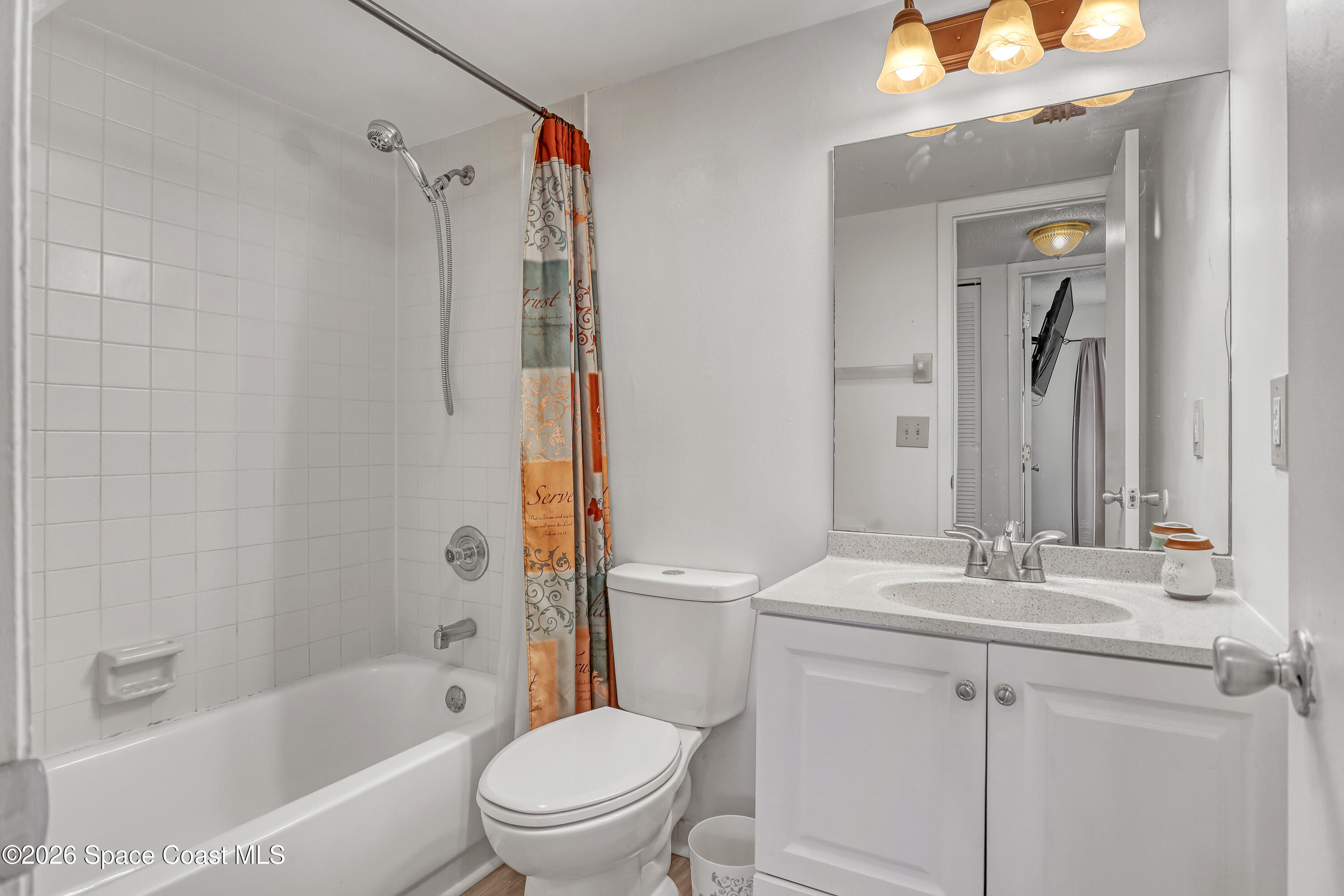 588 North Wickham Road, Unit 51 Melbourne, FL 32935 - Photo 18 of 27 a bathroom with a sink toilet and shower