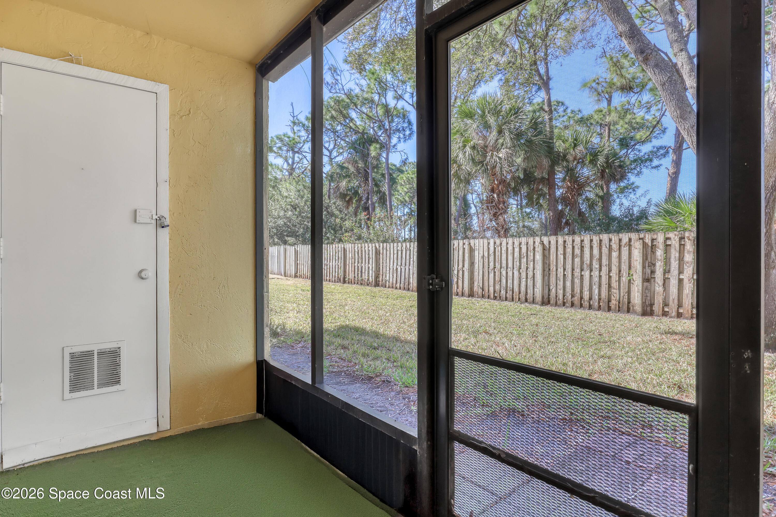 588 North Wickham Road, Unit 51 Melbourne, FL 32935 - Photo 19 of 27 a view of back yard from window