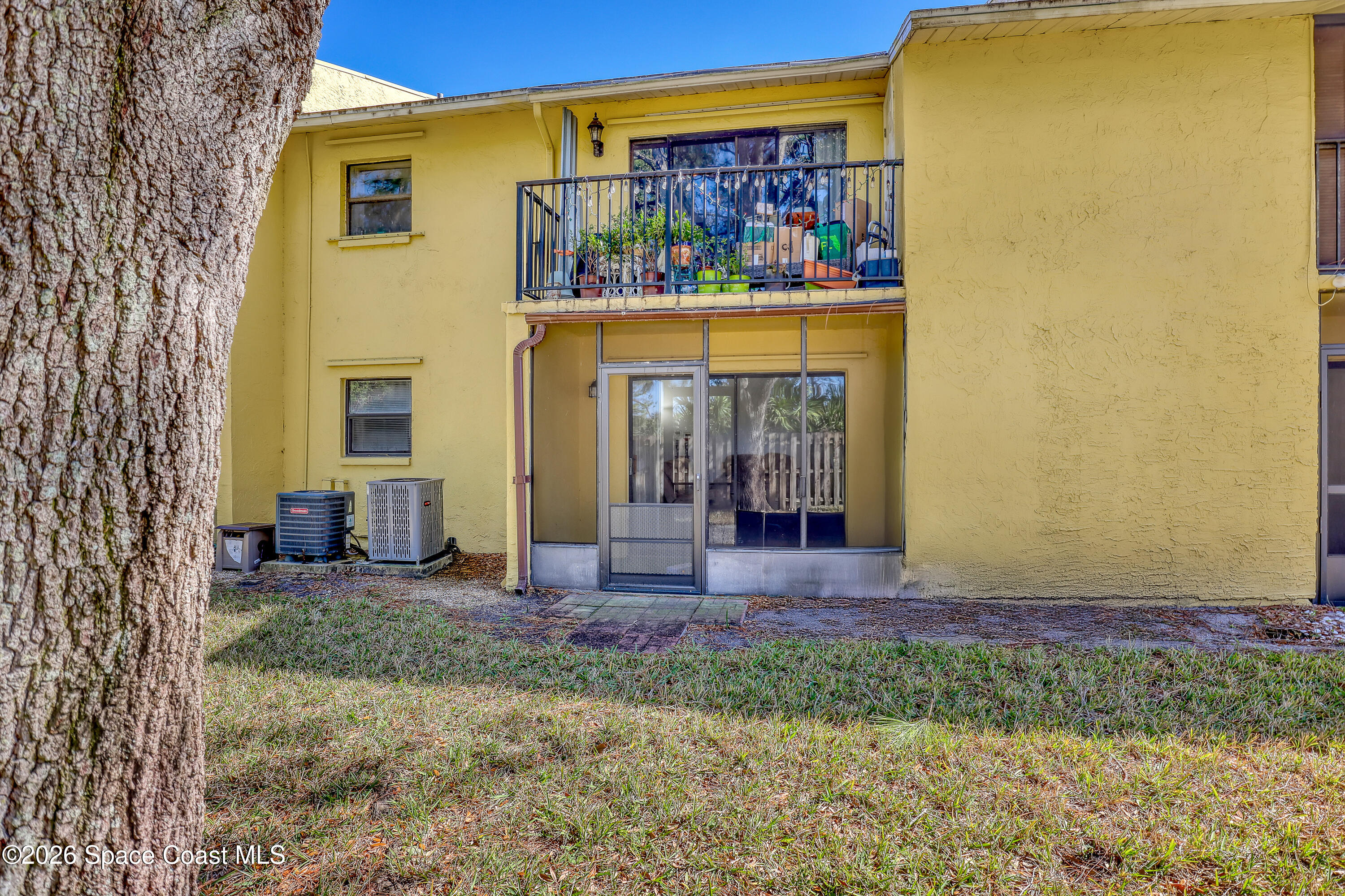 588 North Wickham Road, Unit 51 Melbourne, FL 32935 - Photo 22 of 27 a view of front door of house and yard