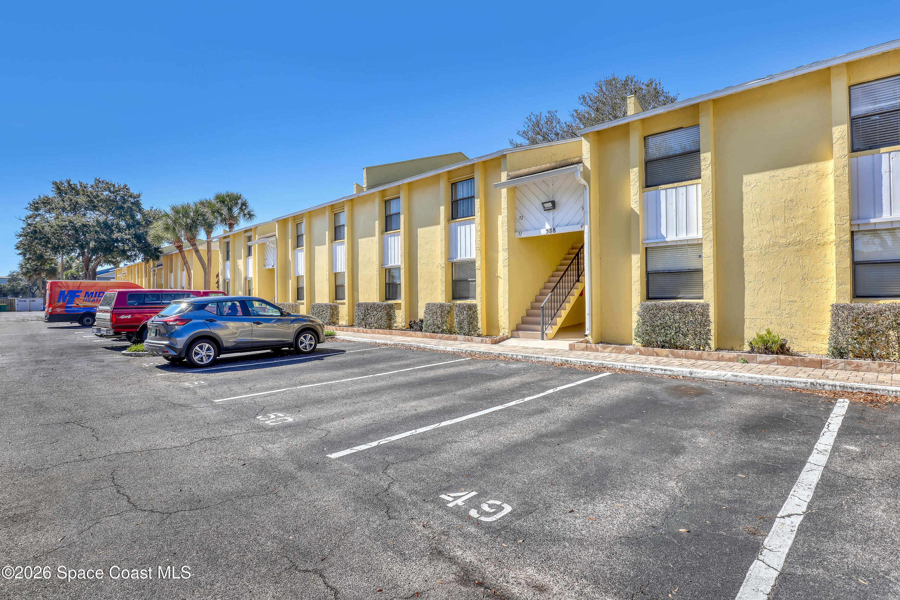 588 North Wickham Road, Unit 51 Melbourne, FL 32935 - Photo 26 of 27 a car parked in front of a building