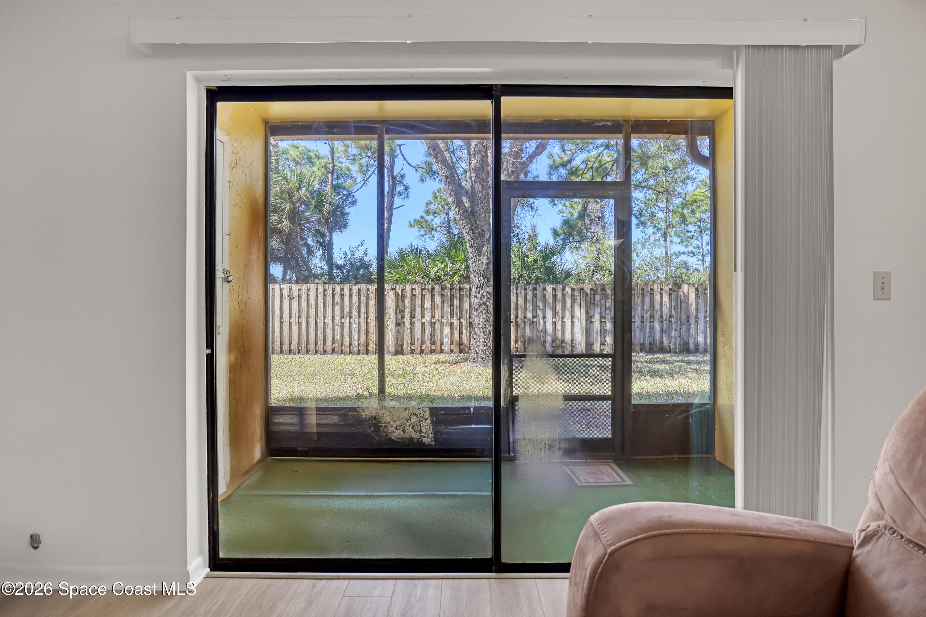 588 North Wickham Road, Unit 51 Melbourne, FL 32935 - Photo 5 of 27 a living room filled with furniture