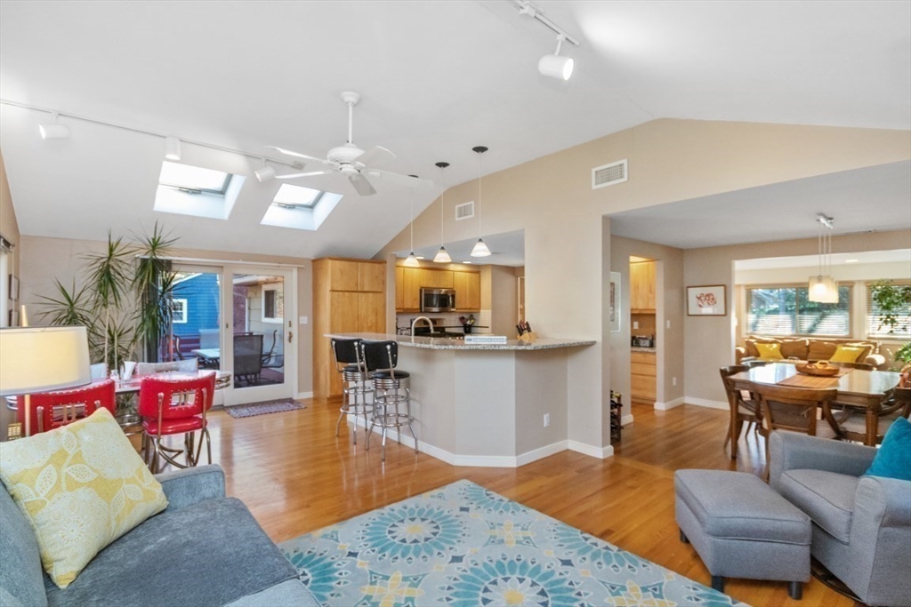 65 Blake Needham, MA 02492 - Photo 8 of 20 a living room with furniture kitchen view and a large window