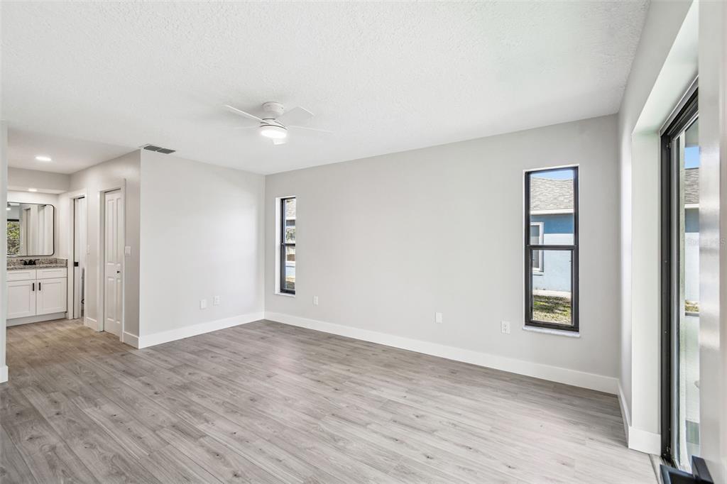 5248 Frost Road Spring Hill, FL 34606 - Photo 17 of 70 a view of an empty room with closet and a window