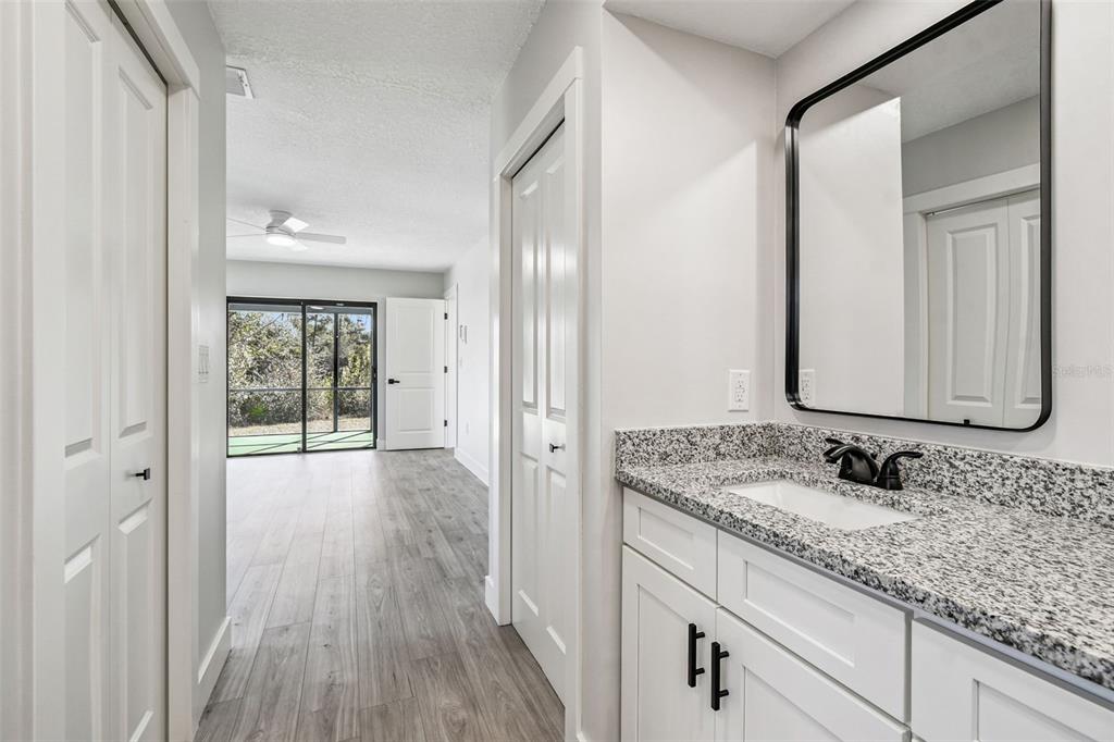 5248 Frost Road Spring Hill, FL 34606 - Photo 24 of 70 a bathroom with a sink and a mirror