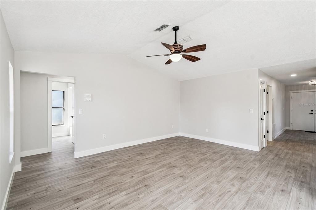 5248 Frost Road Spring Hill, FL 34606 - Photo 40 of 70 a view of empty room with wooden floor