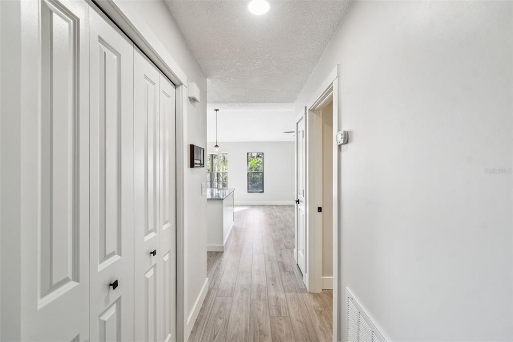 5248 Frost Road Spring Hill, FL 34606 - Photo 44 of 70 a view of a hallway with wooden floor