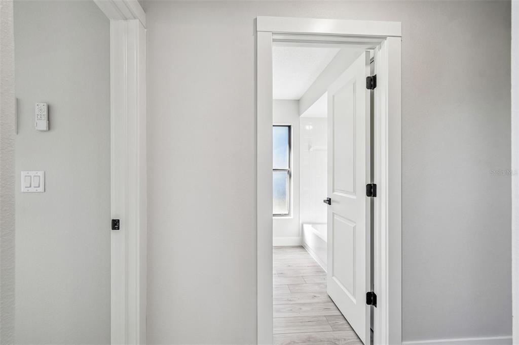 5248 Frost Road Spring Hill, FL 34606 - Photo 46 of 70 a view of a bathroom from a hallway