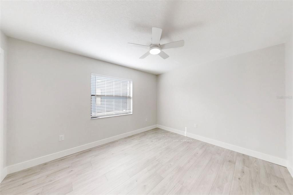 5248 Frost Road Spring Hill, FL 34606 - Photo 53 of 70 an empty room with a window and ceiling fan