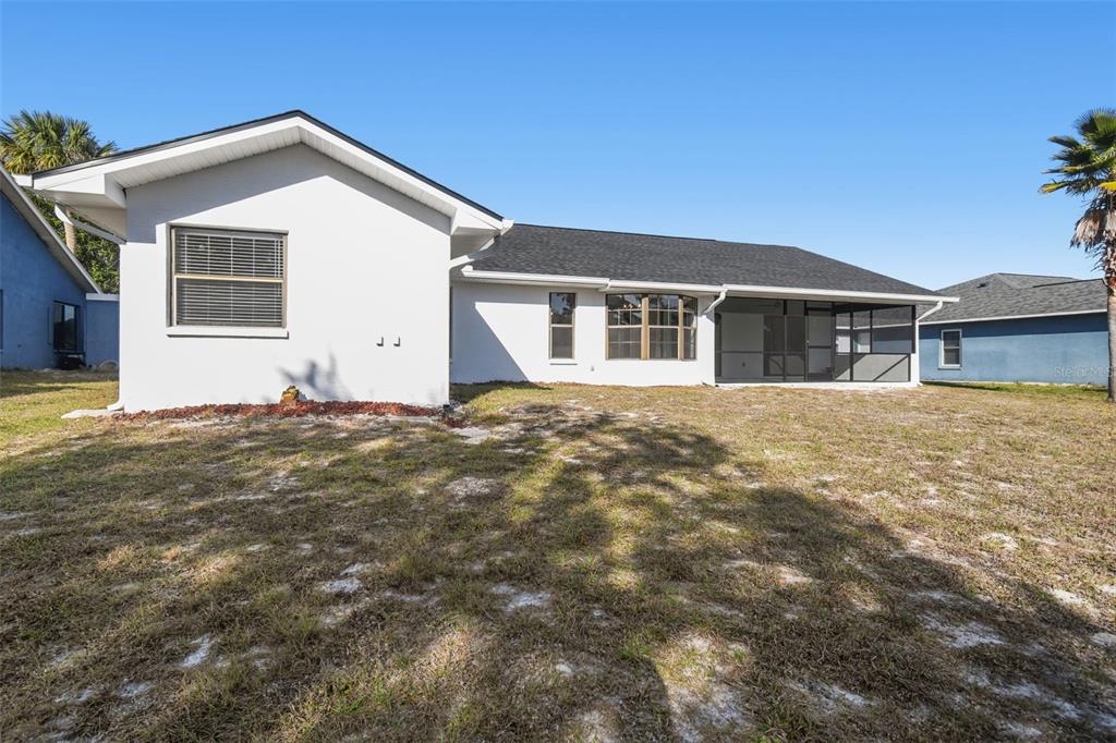 5248 Frost Road Spring Hill, FL 34606 - Photo 59 of 70 a front view of a house with a yard