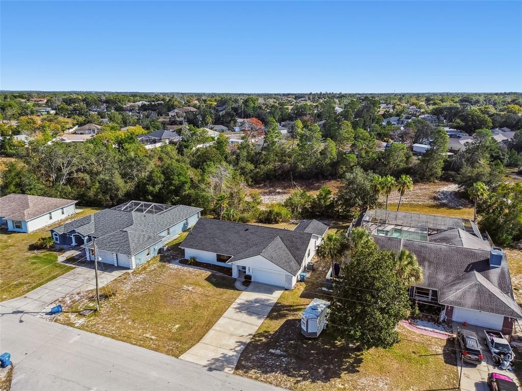 5248 Frost Road Spring Hill, FL 34606 - Photo 64 of 70 an aerial view of residential houses with outdoor space