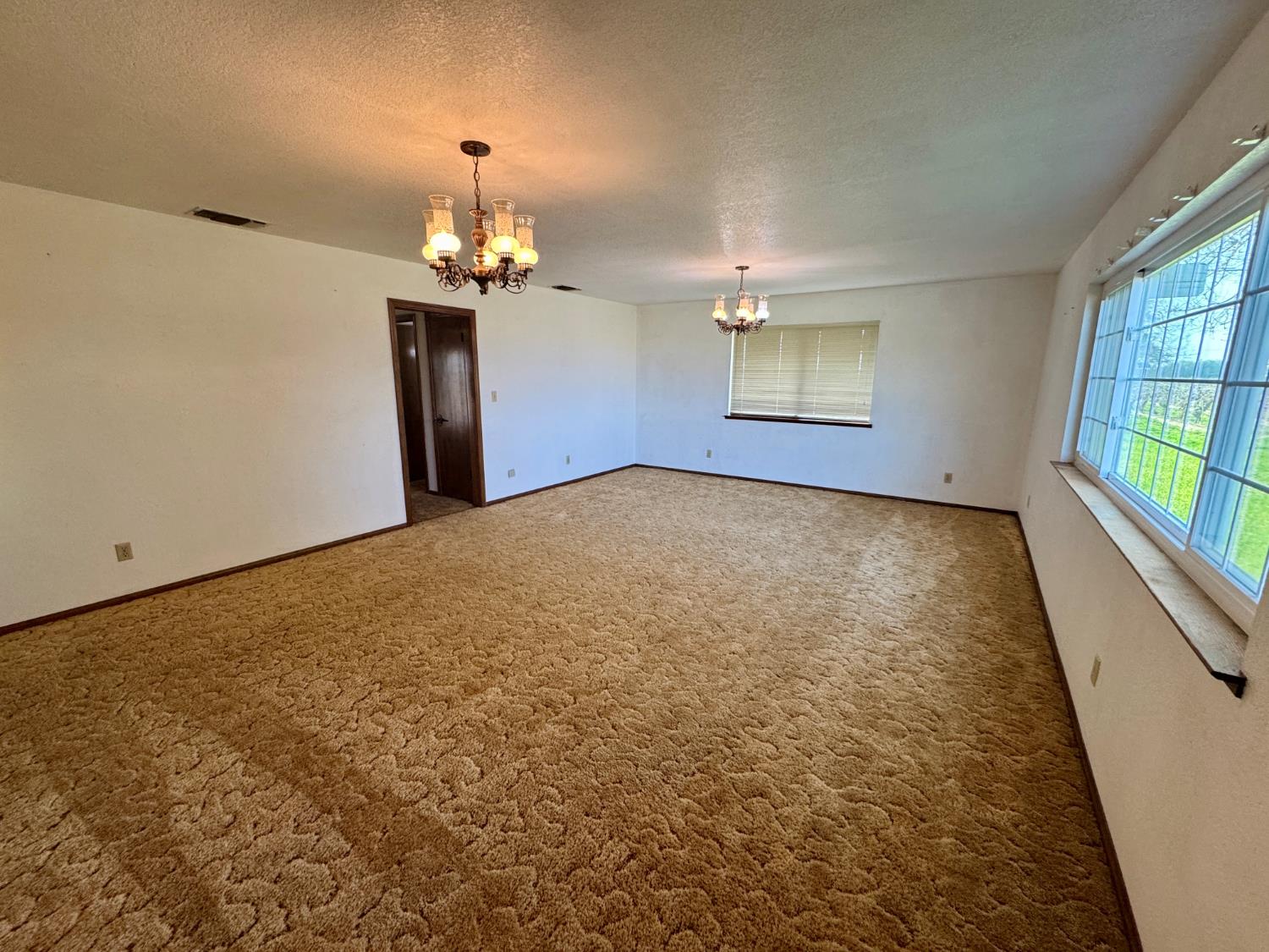 17617 West Belmont Avenue Kerman, CA 93630 - Photo 11 of 25 wooden floor in an empty room with a window