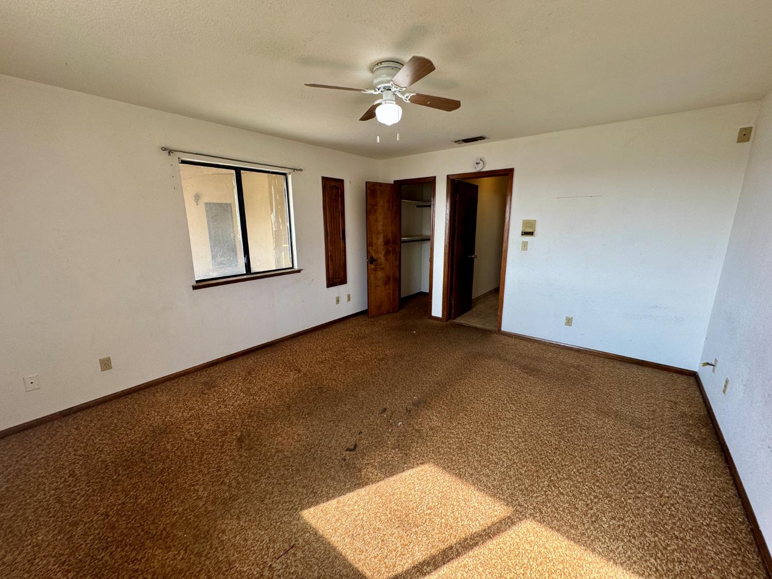 17617 West Belmont Avenue Kerman, CA 93630 - Photo 18 of 25 a view of an empty room with a window