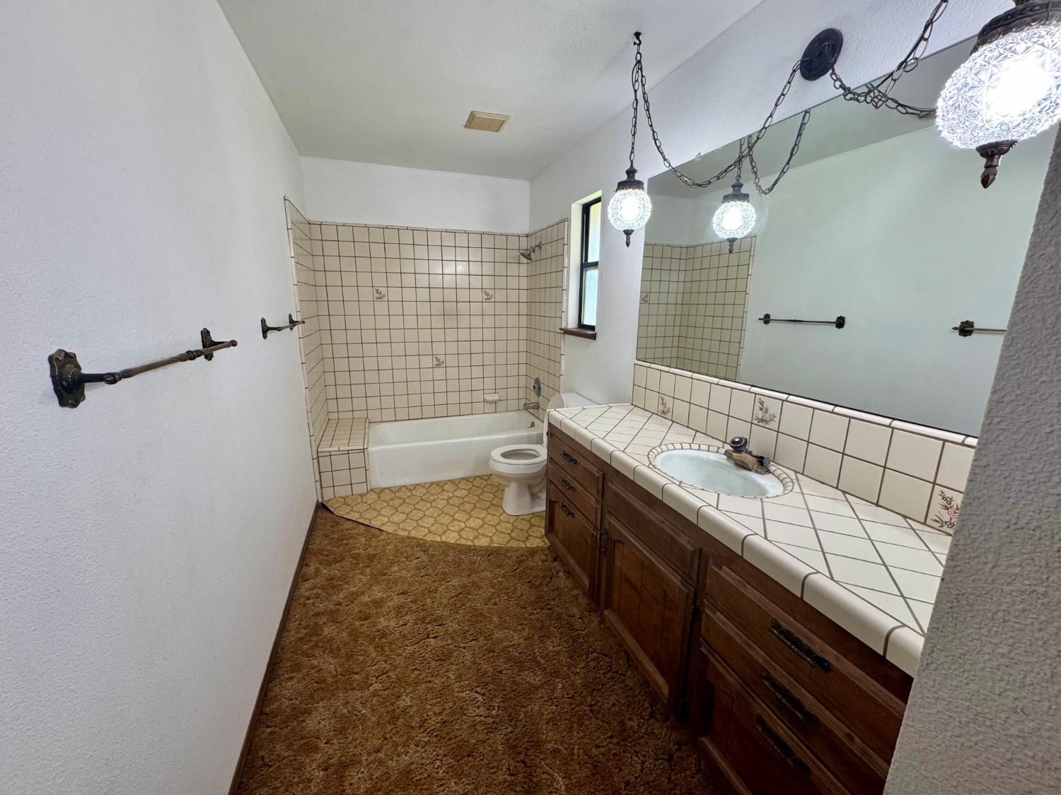 17617 West Belmont Avenue Kerman, CA 93630 - Photo 20 of 25 a bathroom with a granite countertop sink a toilet and shower