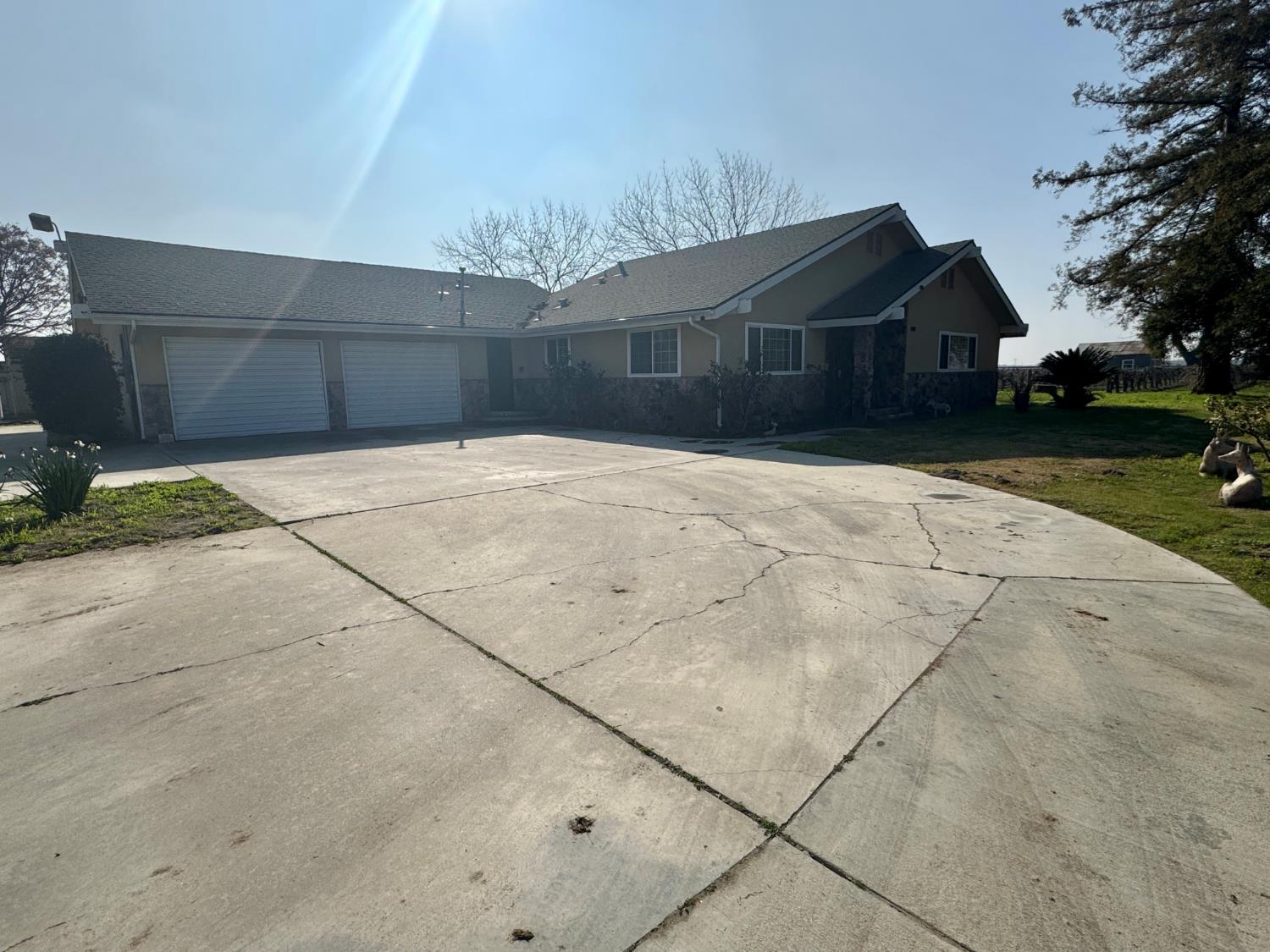 17617 West Belmont Avenue Kerman, CA 93630 - Photo 2 of 25 a house view with a backyard space