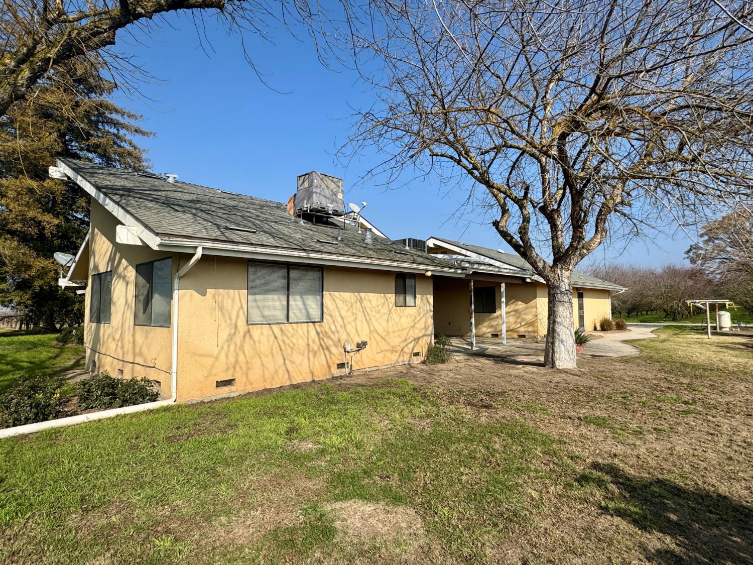 17617 West Belmont Avenue Kerman, CA 93630 - Photo 23 of 25 a view of a house with a yard