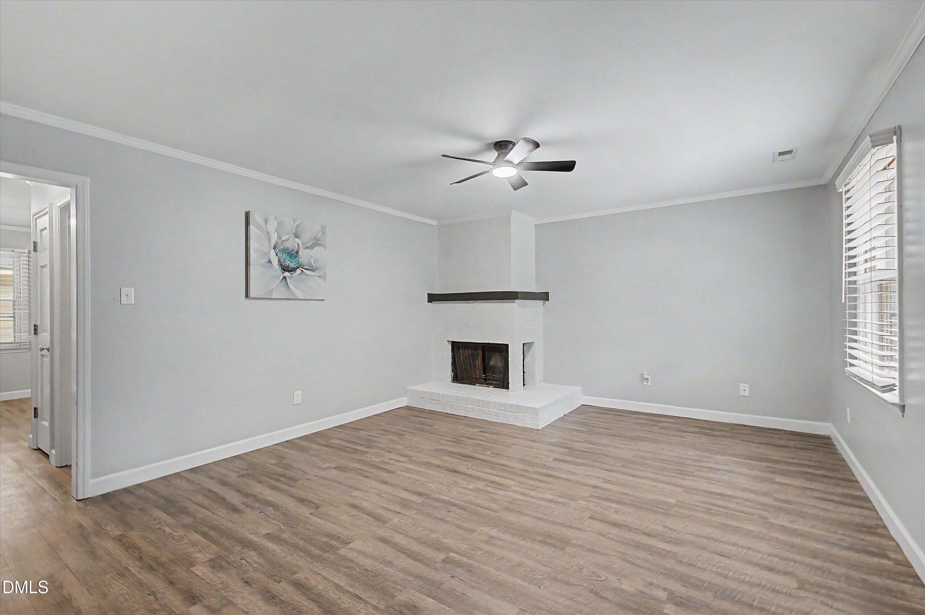 5519 Hamstead Crossing Raleigh, NC 27612 - Photo 3 of 33 wooden floor in an empty room with a window
